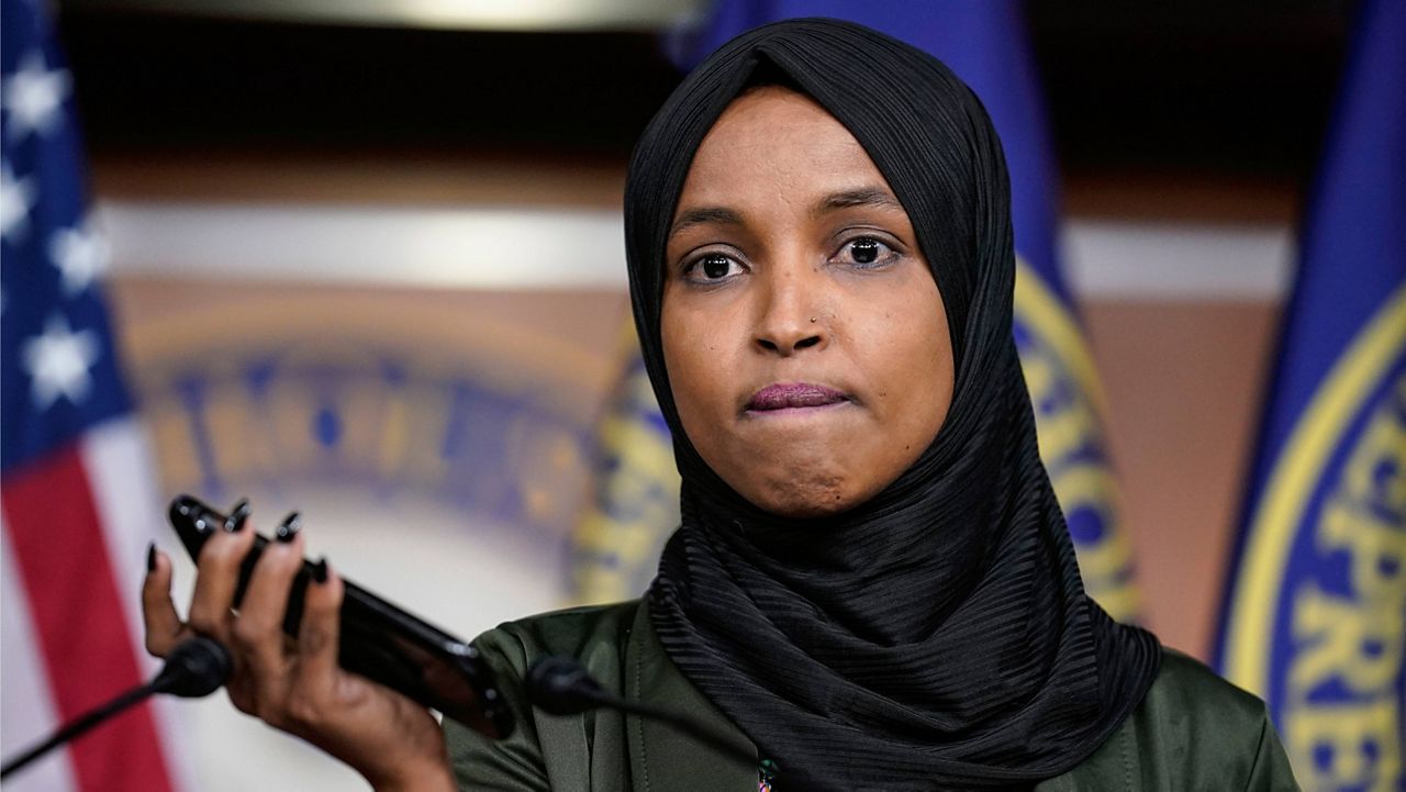 Rep. Ilhan Omar, D-Minn., plays a recording Tuesday of a death threat left on her voicemail in the wake of anti-Islamic comments made last week by Rep. Lauren Boebert, R-Colo.. (AP Photo/J. Scott Applewhite)