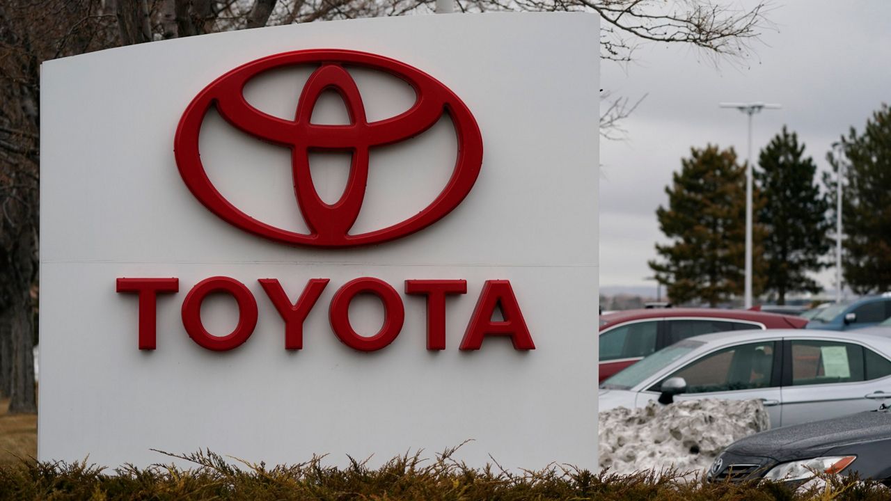 The company logo adorns a sign outside a Toyota dealership Sunday, March 21, 2021, in Lakewood, Colo. North Carolina officials have scheduled a Monday, Dec. 6, 2021, news conference to announce a major economic development project, which likely will be construction of a Toyota electric vehicle battery factory with 1,750 workers. Officials from the state and an unidentified company will attend. (AP Photo/David Zalubowski, File)