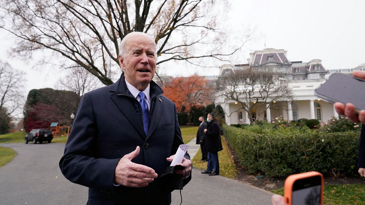 President Joe Biden talks with reporters at the White House in Washington, Wednesday, Dec. 8, 2021, as heads to Missouri to promote the bipartisan infrastructure law. (AP Photo/Susan Walsh)