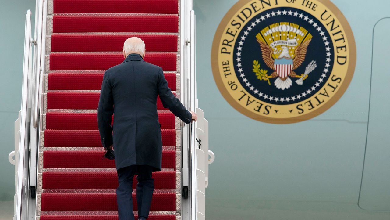 President Joe Biden boards Air Force One for a trip to Kansas City, Mo., Wednesday, Dec. 8, 2021, at Andrews Air Force Base, Md. (AP Photo/Gemunu Amarasinghe)