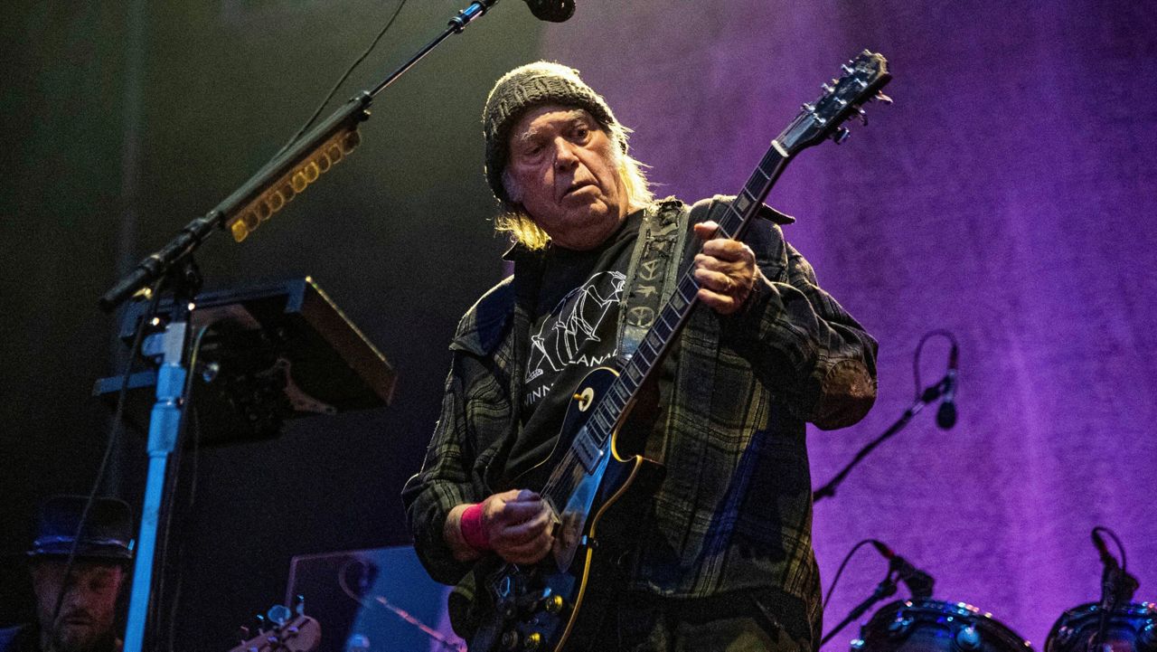 Neil Young performs in Napa, Calif., on May 25, 2019. (Photo by Amy Harris/Invision/AP, File)