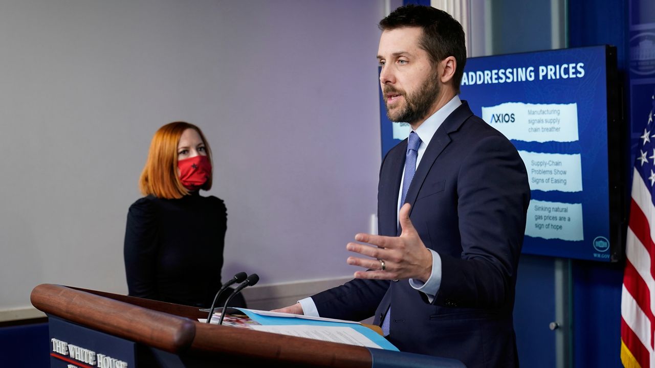 National Economic Council Director Brian Deese, right, speaks during the daily briefing at the White House in Washington, Thursday, Dec. 9, 2021, as White House press secretary Jen Psaki, left, listens. (AP Photo/Susan Walsh)