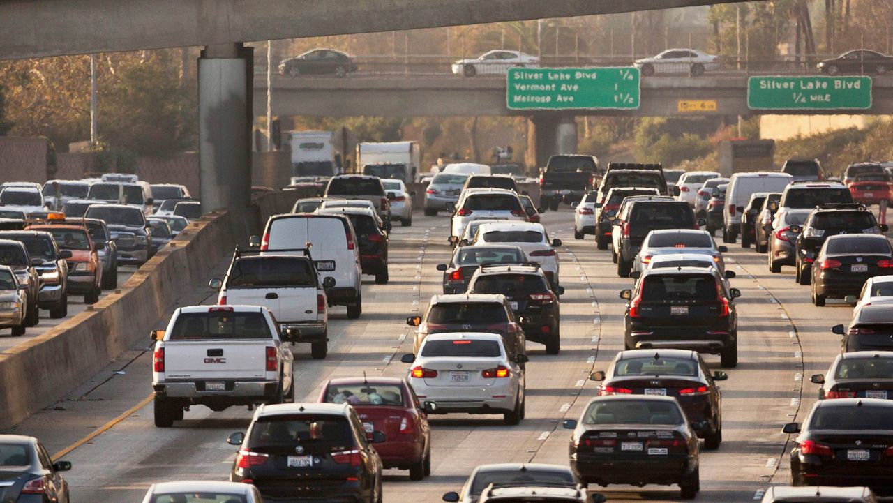 Traffic travels along the Hollywood Freeway in Los Angeles. (AP Photo/Damian Dovarganes, File)