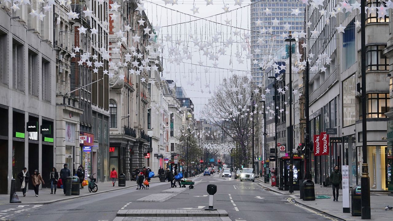 Oxford Street in central London as it lies empty on Christmas Day, Saturday, Dec. 25, 2021. (Jonathan Brady/PA via AP)