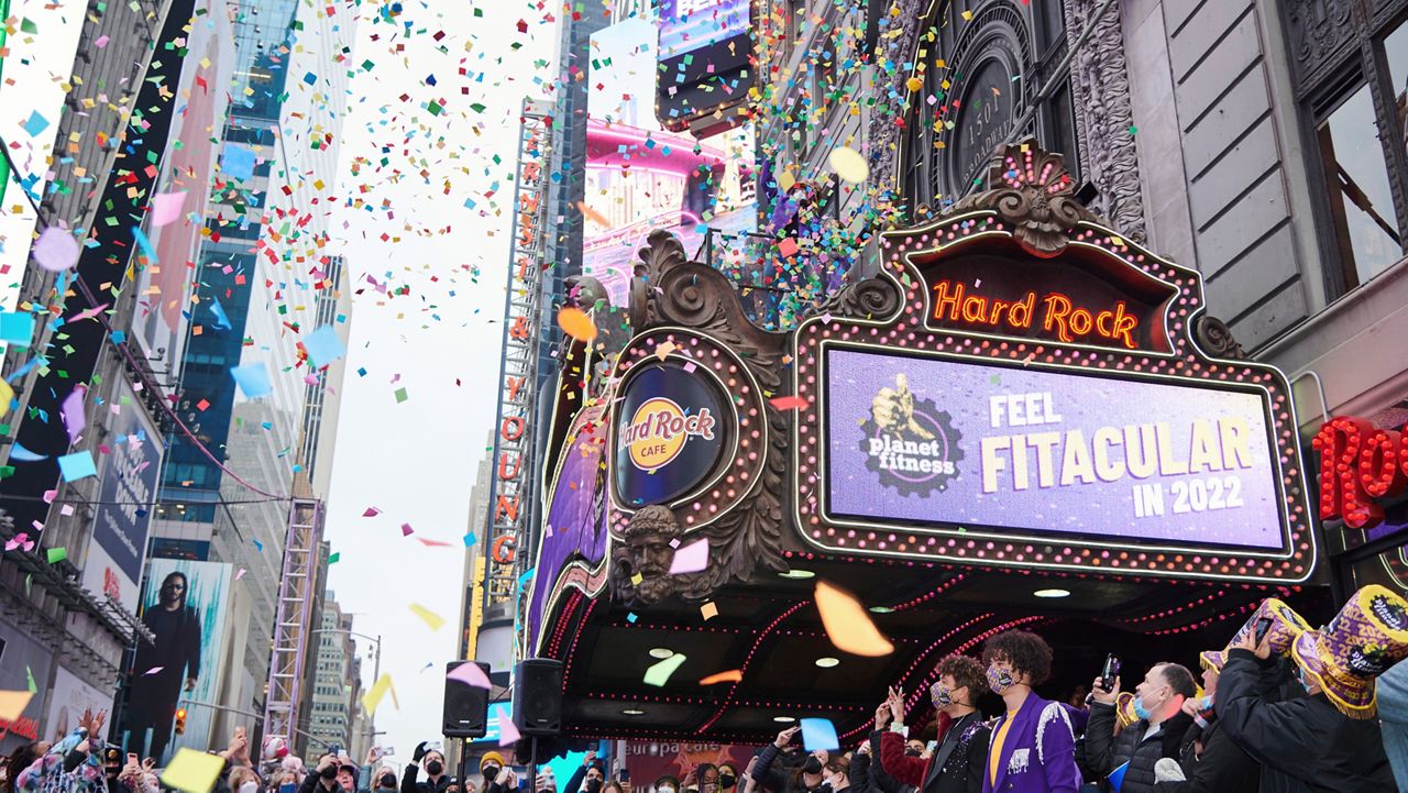 Attendees join in on the fun of Planet Fitness' Confetti Test, testing its "airworthiness" ahead of Times Square's New Year's Eve celebration. (Loren Matthew/AP Images for Planet Fitness)