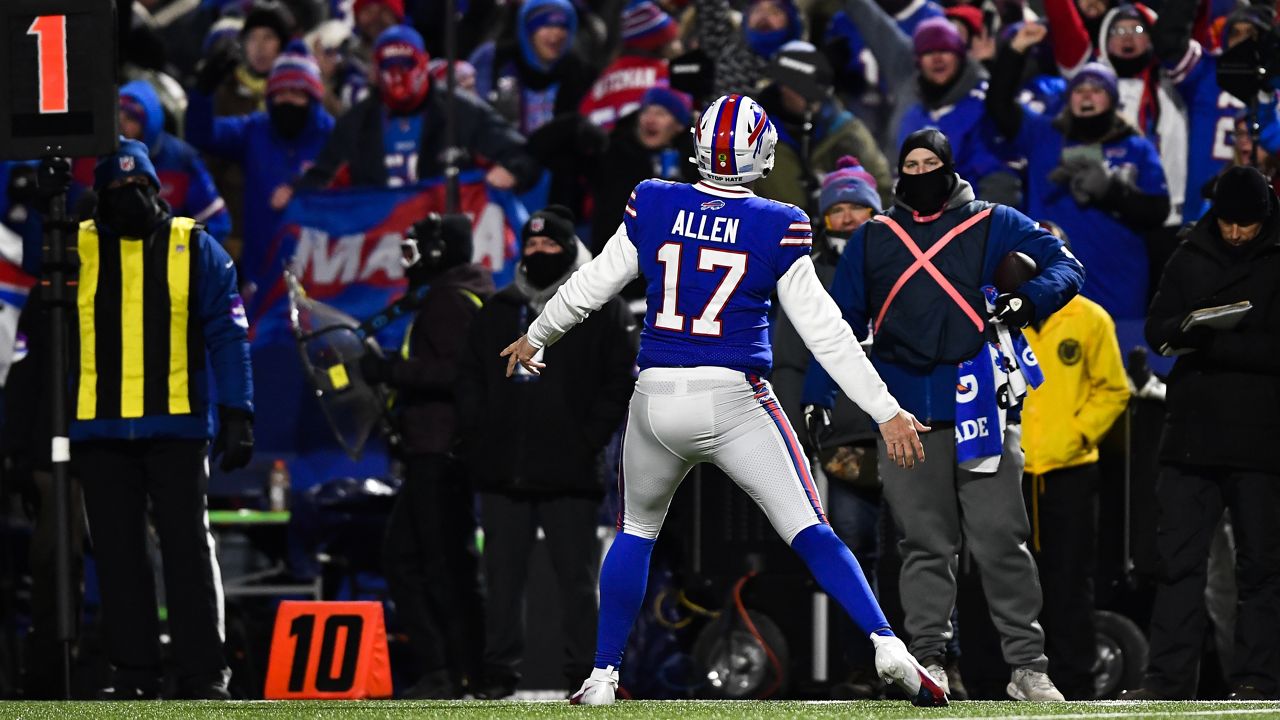 Buffalo Bills quarterback Josh Allen (17) reacts towards the fans after tight end Dawson Knox (88) scores a touchdown during the first half of an NFL wild-card playoff football game, Saturday, Jan. 15, 2022, in Orchard Park, N.Y. (AP Photo/Adrian Kraus)