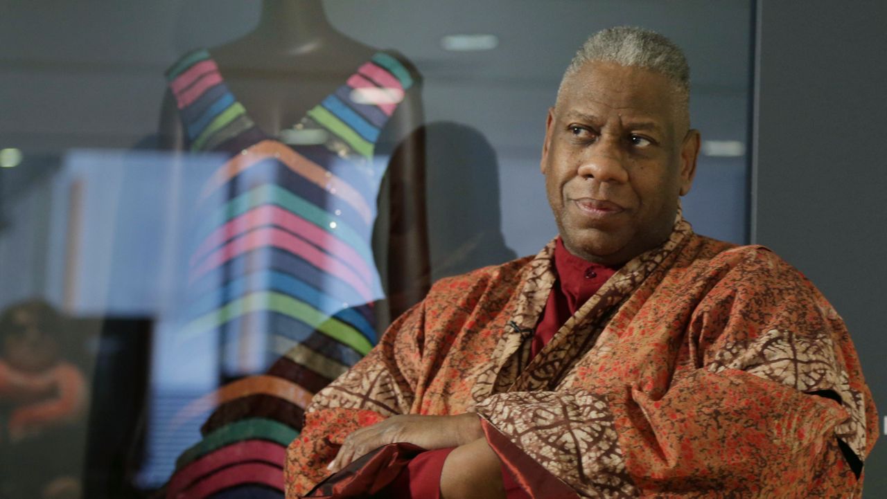 FILE - André Leon Talley, a former editor at large for Vogue magazine, speaks to a reporter at the opening of the "Black Fashion Designers" exhibit at the Fashion Institute of Technology in New York, Tuesday, Dec. 6, 2016. (AP Photo/Seth Wenig, File)