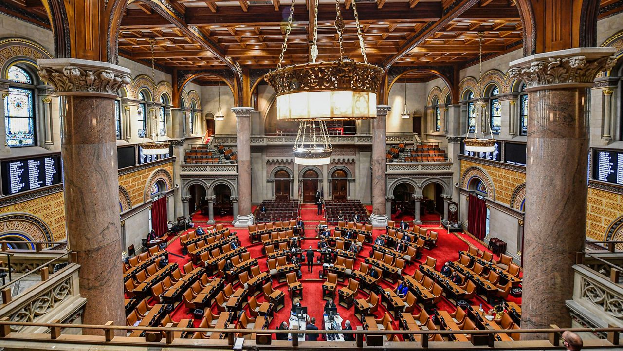 FILE - View of the New York state Assembly Chamber as members meet on the opening day of the 2021 legislative session at the state Capitol in Albany, N.Y. Wednesday, Jan. 6, 2021, in Albany, N.Y. (AP Photo/Hans Pennink, File)