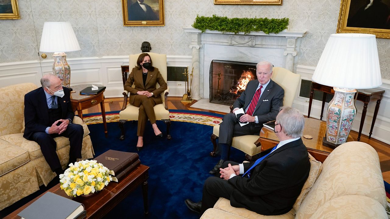 President Joe Biden and Vice President Kamala Harris meet with Sen. Dick Durbin, D-Ill., right, chairman of the Senate Judiciary Committee, and Sen. Chuck Grassley, R-Iowa, left, the ranking member, to discuss the upcoming Supreme Court vacancy in the Oval Office of the White House, Tuesday, Feb. 1, 2022, in Washington. (AP Photo/Patrick Semansky)