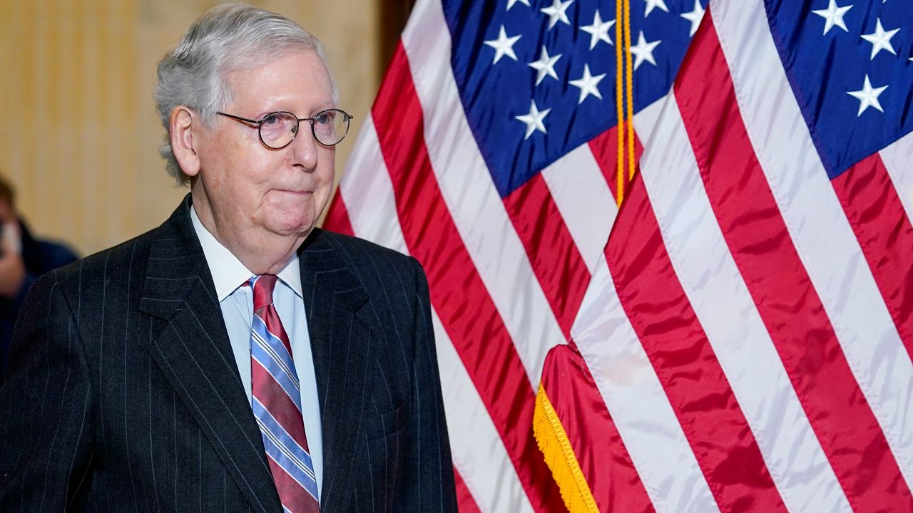 Senate Minority Leader Mitch McConnell of Ky., arrives to speak to reporters on Capitol Hill in Washington, Tuesday, Feb. 8, 2022. (AP Photo/Susan Walsh)