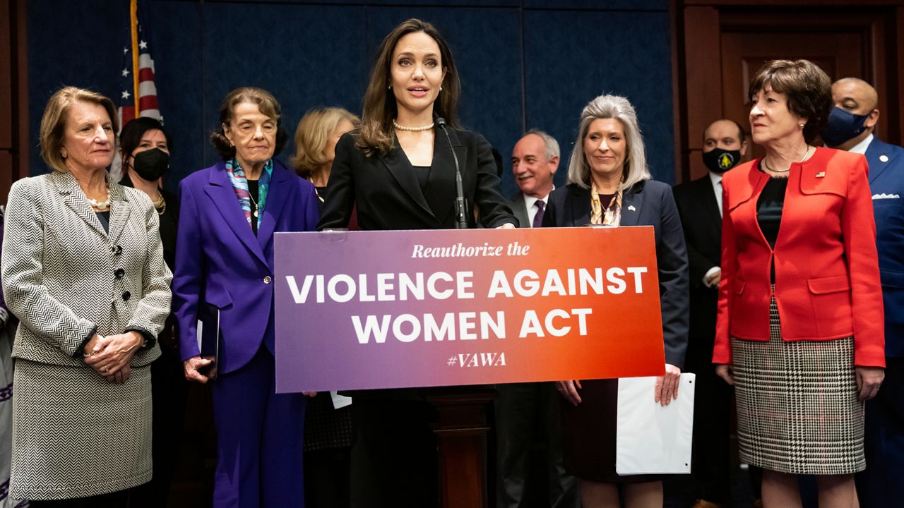 Actress and activist Angelina Jolie, center, joins, from left, Sen. Shelley Moore Capito, R-W.Va., Sen. Dianne Feinstein, D-Calif., Sen. Joni Ernst, R-Iowa, and Sen. Susan Collins, R-Maine, at a news conference to announce a bipartisan update to the Violence Against Women Act, at the Capitol in Washington, Wednesday, Feb. 9, 2022. (AP Photo/J. Scott Applewhite)