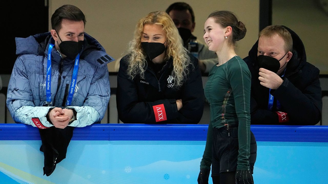 Kamila Valieva, of the Russian Olympic Committee, talks to coaches Thursday at a training session in Beijing. (AP Photo/Jeff Roberson)