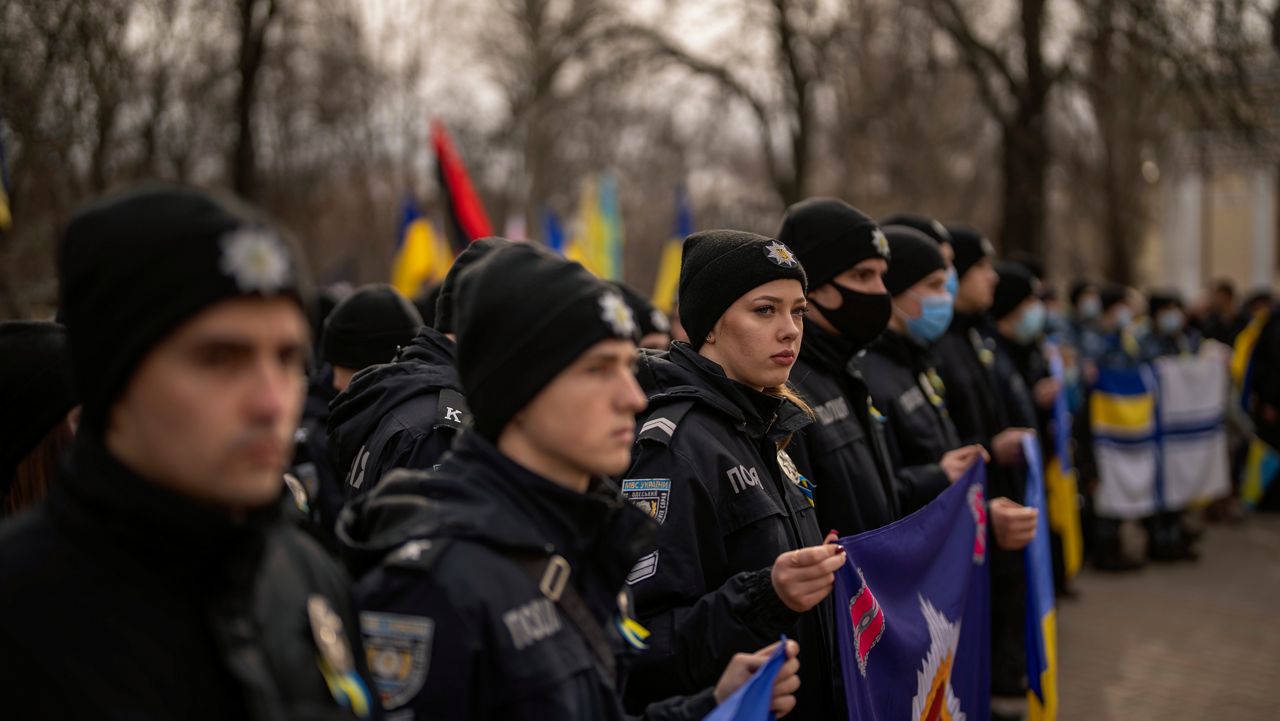 Police officers take part in a protest in Odessa, Ukraine, Sunday, Feb. 20, 2022. (AP Photo/Emilio Morenatti)