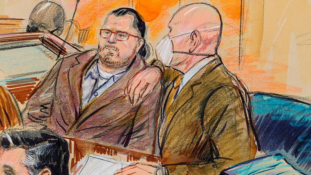 This artist sketch depicts Guy Wesley Reffitt, joined by his lawyer William Welch, right, in Federal Court, in Washington, Monday, Feb. 28, 2022. (Dana Verkouteren via AP)