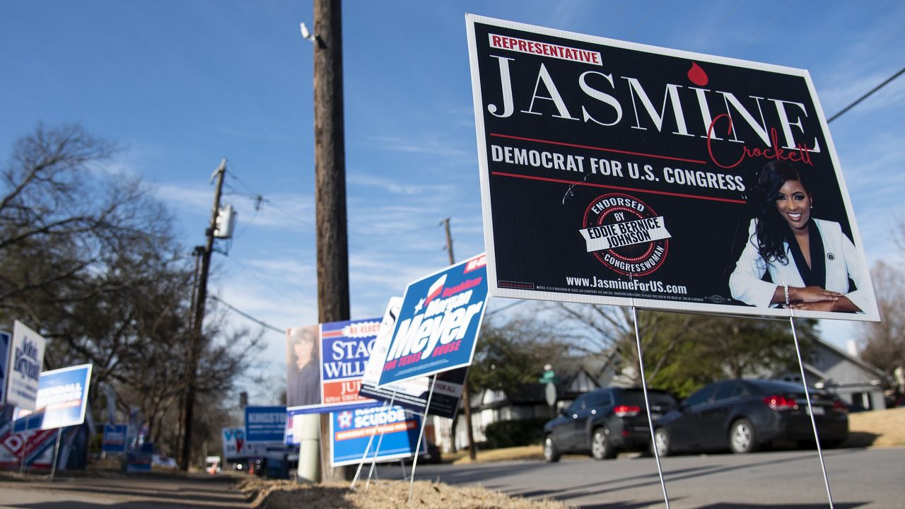 A sign for Jasmine Crockett is posted outside the Lakewood Branch Library as voters trickle in to participate in the Texas primary election in Dallas on Tuesday, March 1, 2022. (AP Photo/Emil Lippe)