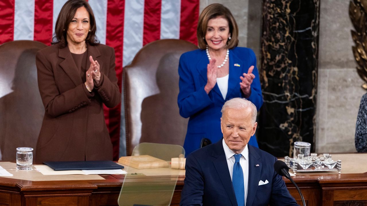 President Joe Biden delivers his first State of the Union address to a joint session of Congress at the Capitol, Tuesday, March 1, 2022, in Washington as Vice President Kamala Harris and House speaker Nancy Pelosi of Calif., applaud. (Jim Lo Scalzo/Pool via AP)