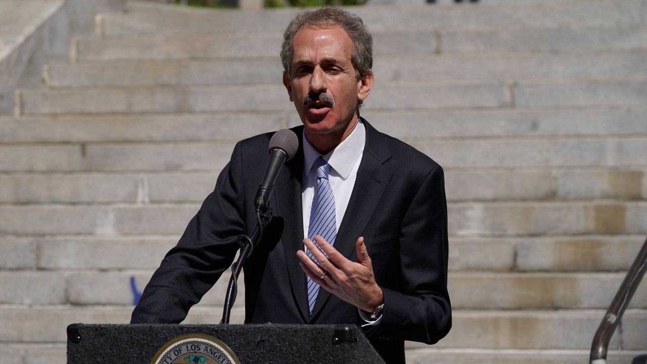 Los Angeles City Attorney Mike Feuer at a news conference outside Los Angeles City Hall, March 7, 2022. (AP Photo/Damian Dovarganes)
