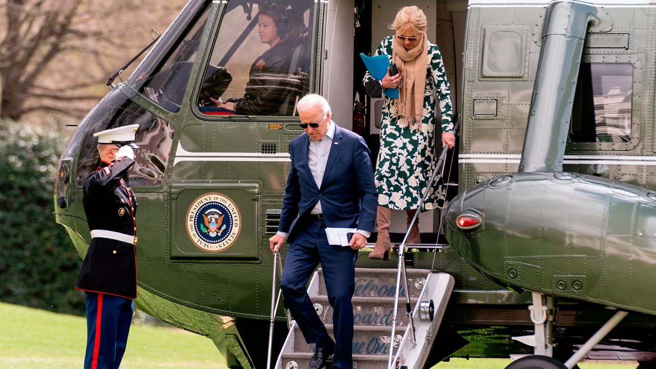 President Joe Biden and first lady Jill Biden arrive at the White House in Washington, Sunday, March 20, 2022, after spending the weekend in Rehoboth Beach, Del. (AP Photo/Andrew Harnik)