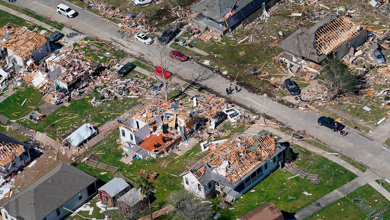 Damaged homes are seen Wednesday after a tornado swept through Arabi, La., the night before. (AP Photo/Gerald Herbert)