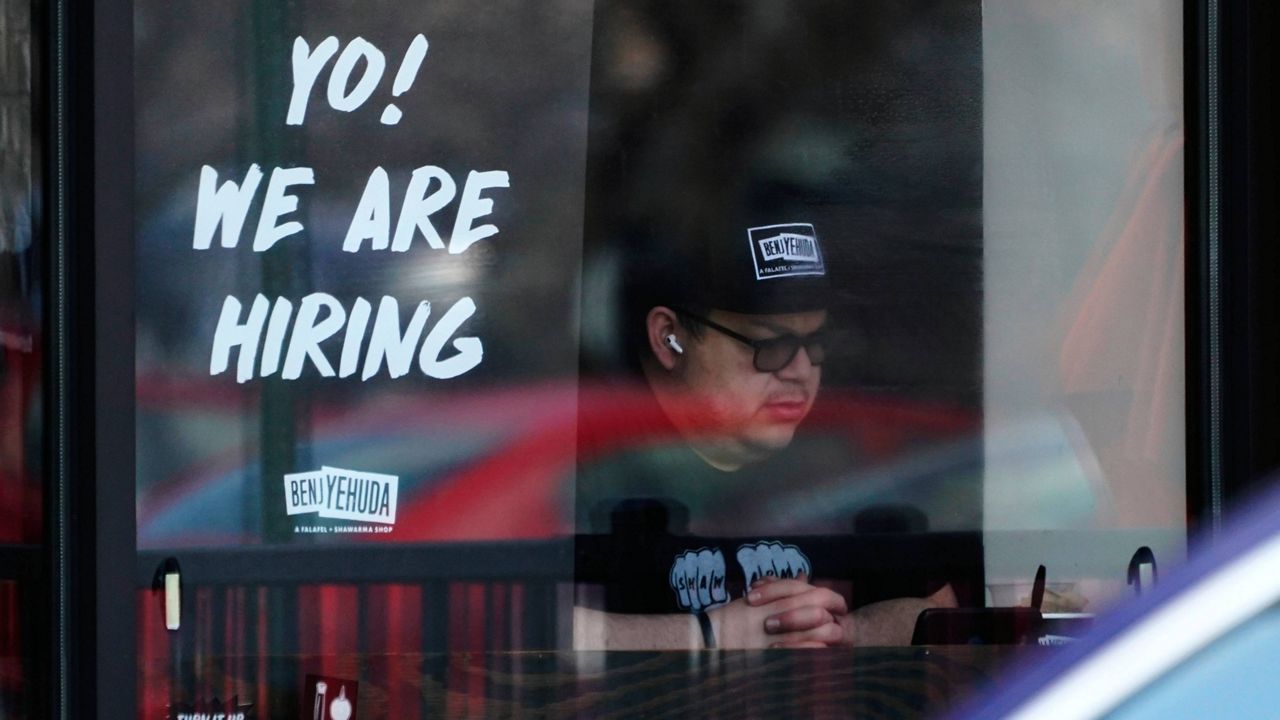 A hiring sign is displayed at a restaurant in Schaumburg, Ill., on April 1. (AP Photo/Nam Y. Huh)