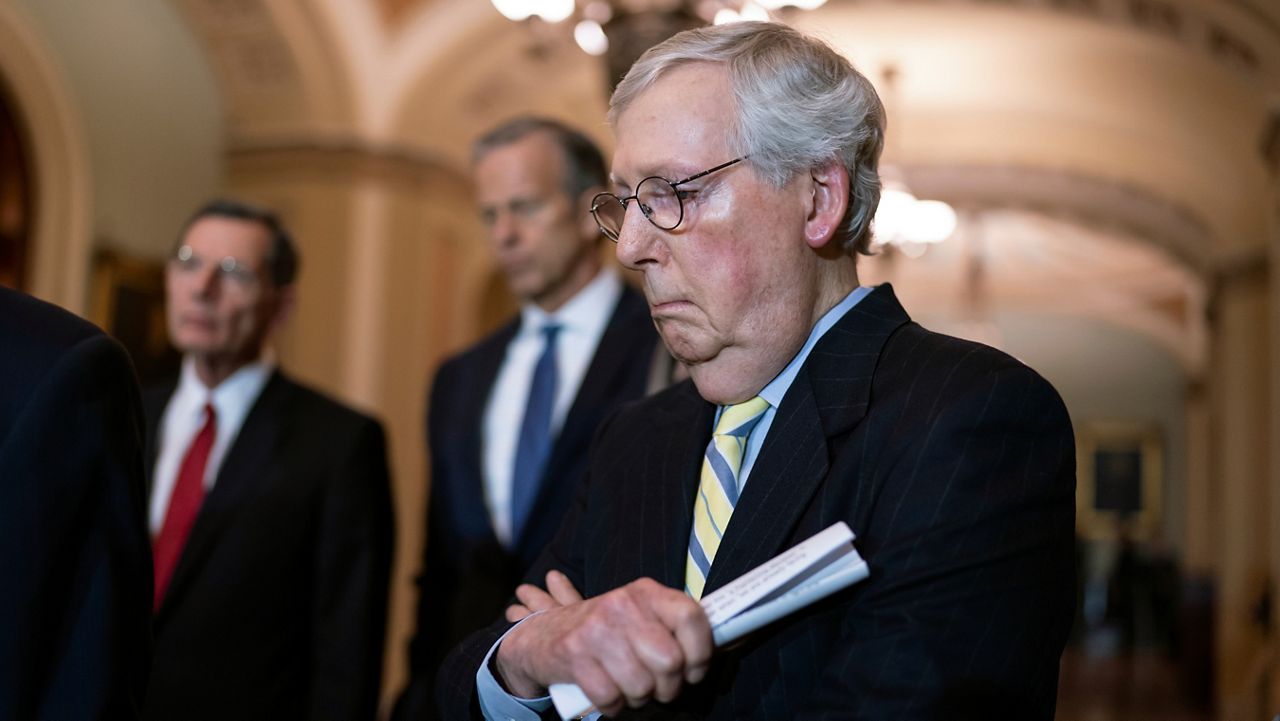 Senate Minority Leader Mitch McConnell, R-Ky., listens to a question from a reporter at the Capitol in Washington, Tuesday, April 5, 2022. (AP Photo/J. Scott Applewhite)