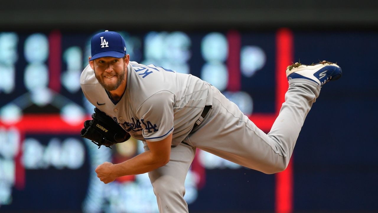 Los Angeles Dodgers pitcher Clayton Kershaw throws against the Minnesota Twins during the first inning of a baseball game, Wednesday, April 13, 2022, in Minneapolis. (AP Photo/Craig Lassig)