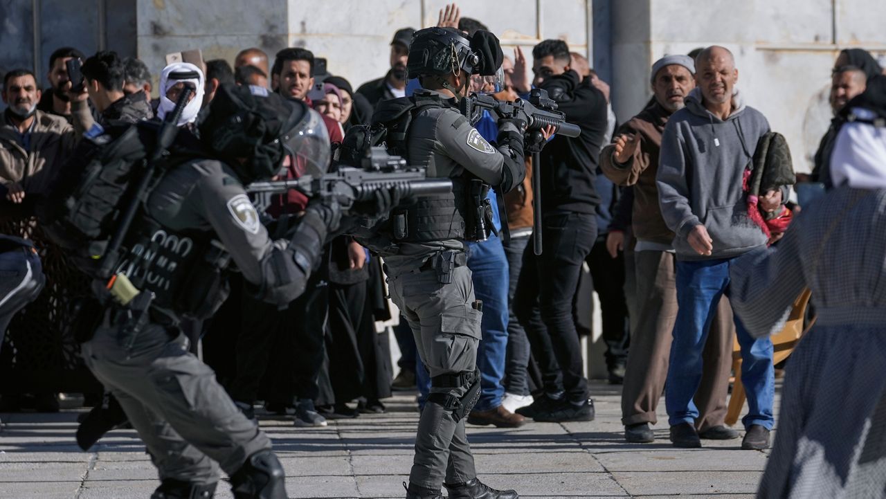 Israeli security forces take position during clashes with Palestinians demonstrators at the Al Aqsa Mosque compound in Jerusalem's Old City, Friday, April 15, 2022. (AP Photo/Mahmoud Illean)