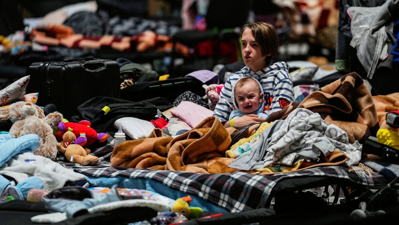 FILE - Children sit in a refugee center in Nadarzyn, near Warsaw, Poland, on Friday, March 25, 2022. (AP Photo/Petr David Josek, File)