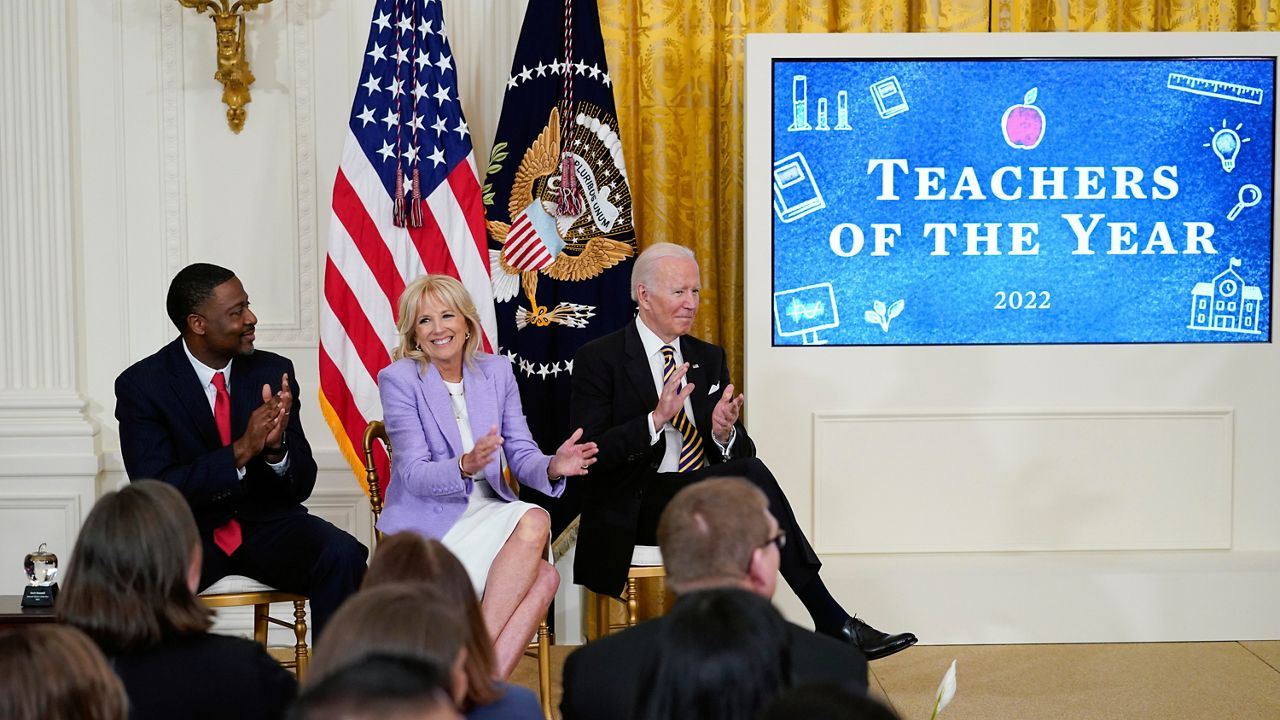 President Joe Biden, first lady Jill Biden and 2022 National Teacher of the Year Kurt Russell applaud the 2022 National and State Teachers of the Year during an event in the East Room of the White House in Washington, Wednesday, April 27, 2022. (AP Photo/Susan Walsh)