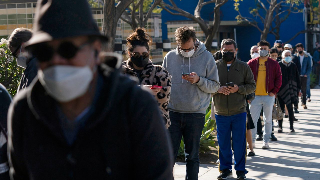 People wait in line for a COVID-19 test in Los Angeles, Jan. 4, 2022. (AP Photo/Jae C. Hong, File)