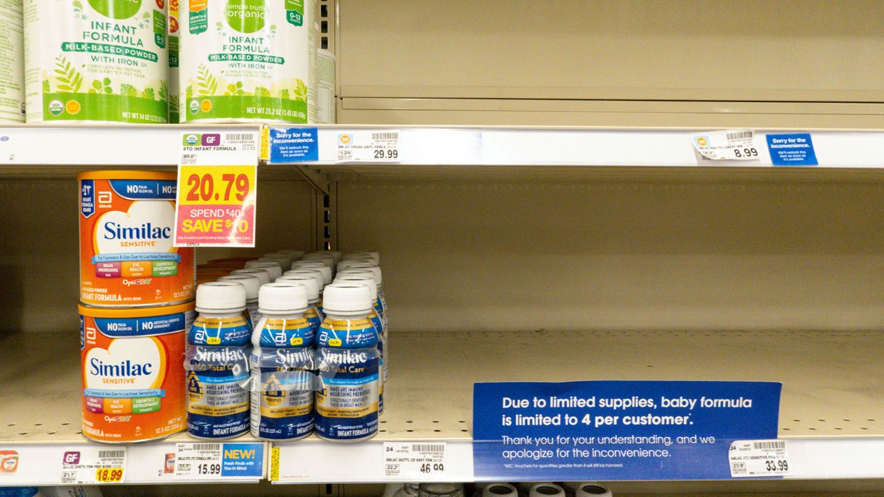 Baby formula is displayed on the shelves of a grocery store with a sign limiting purchases in Indianapolis, Tuesday, May 10, 2022. Parents across the U.S. are scrambling to find baby formula because supply disruptions and a massive safety recall have swept many leading brands off store shelves. (AP Photo/Michael Conroy)