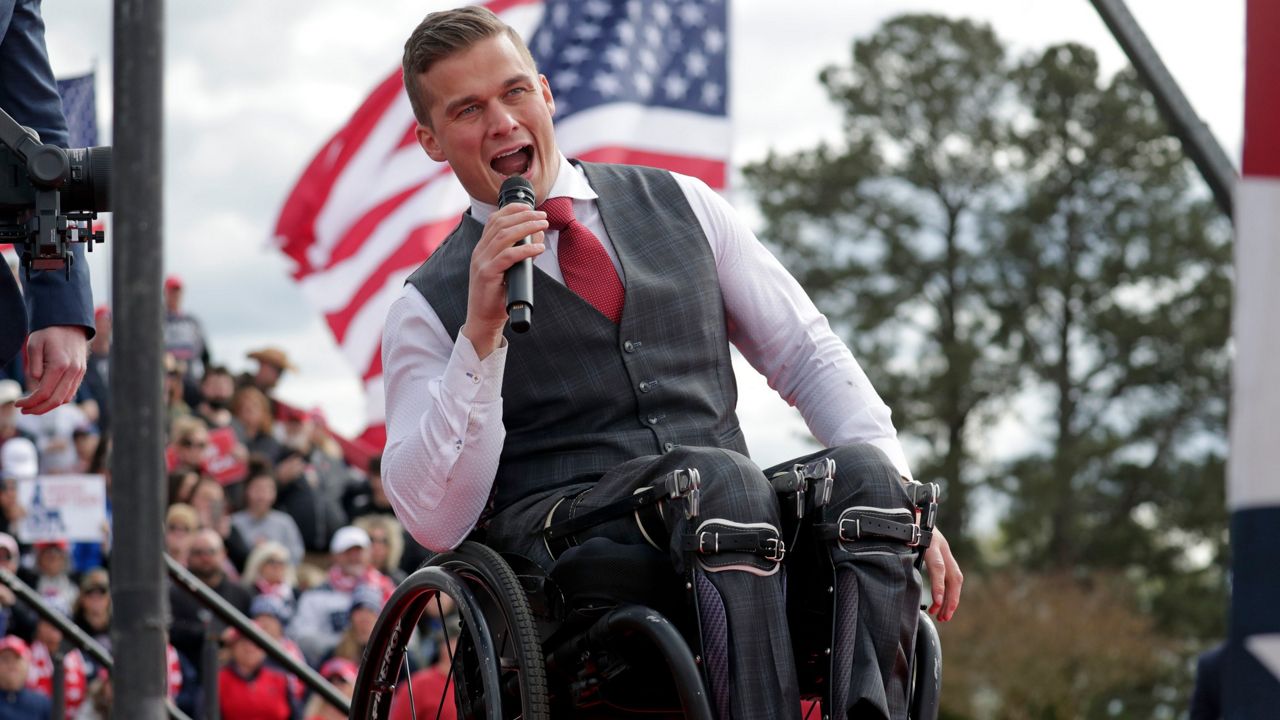 FILE - Rep. Madison Cawthorn, R-N.C., speaks before former President Donald Trump takes the stage at a rally on April 9, 2022, in Selma, N.C. A series of unforced political and personal errors by Cawthorn has brought the forces of big-name Republicans and traditional enemies to bear on his reelection bid in North Carolina.(AP Photo/Chris Seward, File)