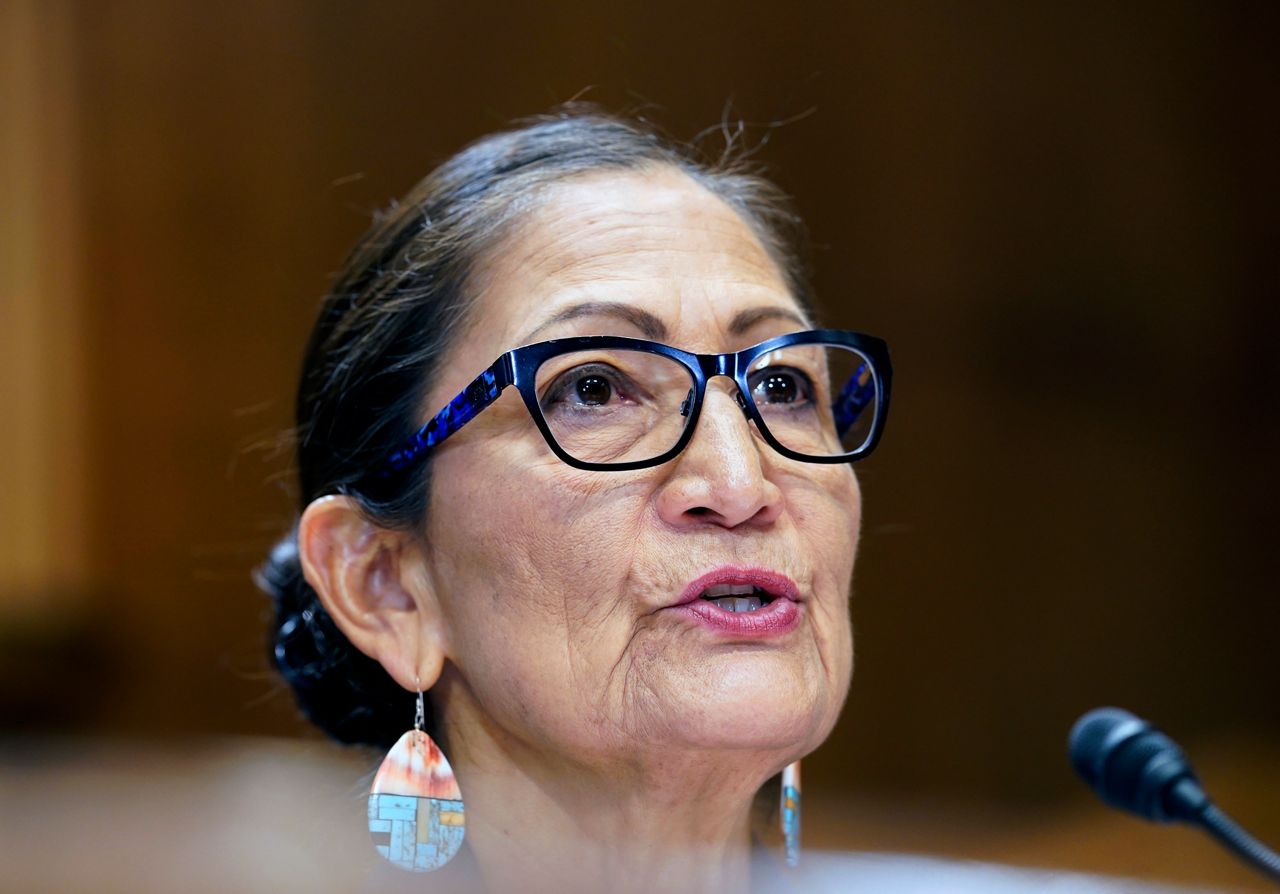 Interior Secretary Deb Haaland speaks during a Senate Energy and Natural Resources Committee hearing on May 19 on Capitol Hill in Washington in this file photo. The U.S. government has joined a ski resort and others that have quit using a racist term for a Native American woman by renaming hundreds of peaks, lakes, streams and other geographical features on federal lands in the West and elsewhere. Haaland in November declared the term derogatory and ordered members of the Board on Geographic Names, the Interior Department panel that oversees uniform naming of places in the U.S., and others to come up with alternatives. (AP Photo/Mariam Zuhaib, File)