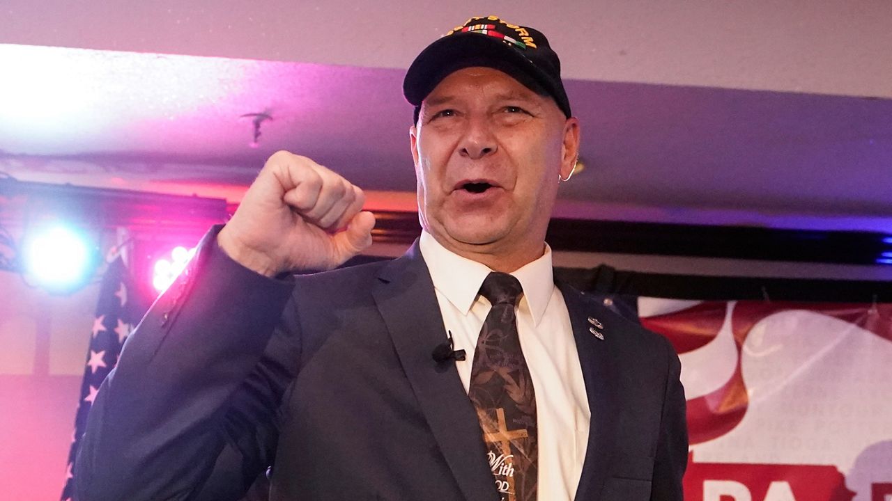 FILE - State Sen. Doug Mastriano, R-Franklin, the Republican candidate for Governor of Pennsylvania, gestures to the cheering crowd during his primary night election party in Chambersburg, Pa., May 17, 2022. (AP Photo/Carolyn Kaster, File)