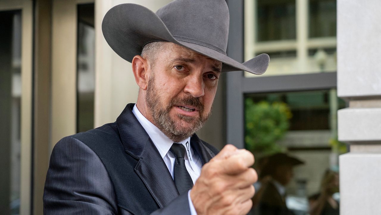 Otero County, New Mexico Commissioner Couy Griffin speaks to reporters at federal court in Washington, Friday, June. 17, 2022. (AP Photo/Gemunu Amarasinghe)