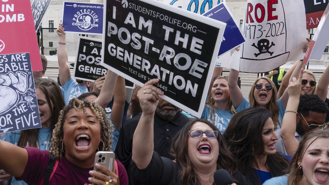 Demonstrators gather outside the Supreme Court in Washington, Friday, June 24, 2022. The Supreme Court has ended constitutional protections for abortion that had been in place nearly 50 years, a decision by its conservative majority to overturn the court's landmark abortion cases. (AP Photo/Jose Luis Magana)
