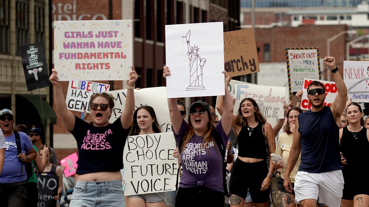 People rally in support of abortion rights Saturday, July 2, 2022, in Kansas City, Mo. (AP Photo/Charlie Riedel)