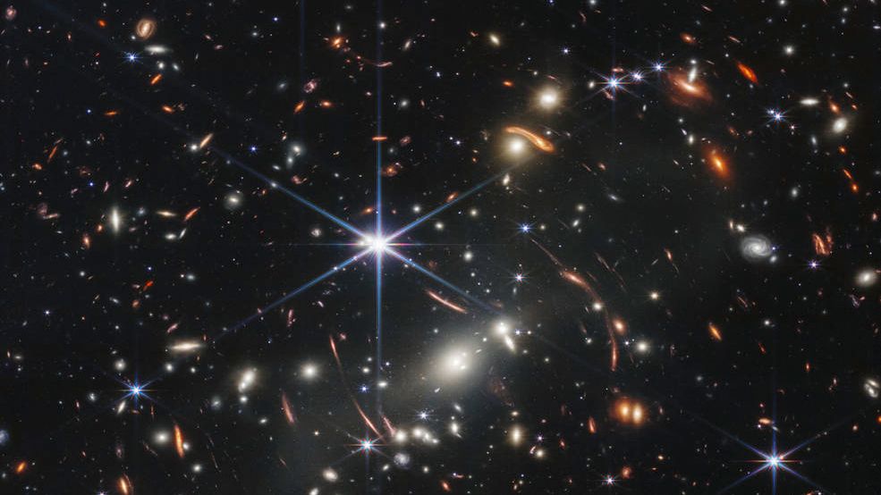 This image provided by NASA on Monday, July 11, 2022, shows galaxy cluster SMACS 0723, captured by the James Webb Space Telescope. The telescope is designed to peer back so far that scientists can get a glimpse of the dawn of the universe about 13.7 billion years ago and zoom in on closer cosmic objects, even our own solar system, with sharper focus. (NASA/ESA/CSA via AP)