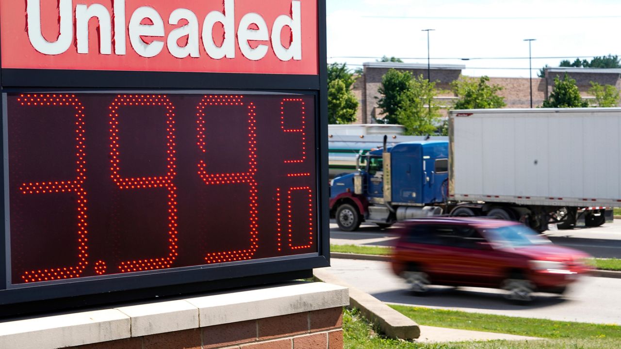 The price of regular unleaded gas is advertised for just under $4 a gallon at a Woodman's, Wednesday, July 20, 2022, in Menomonie Falls, Wis. (AP Photo/Morry Gash)