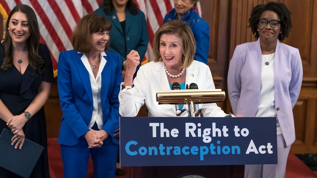 Speaker of the House Nancy Pelosi, D-Calif., smiles as she wraps up an event with Democratic women House members and advocates for reproductive freedom ahead of the vote on the Right to Contraception Act, at the Capitol in Washington, Wednesday, July 20, 2022. In front row, from left, are Rep. Sara Jacobs, D-Calif., Rep. Kathy Manning, D-N.C., and Rep. Lauren Underwood, D-Ill. (AP Photo/J. Scott Applewhite)