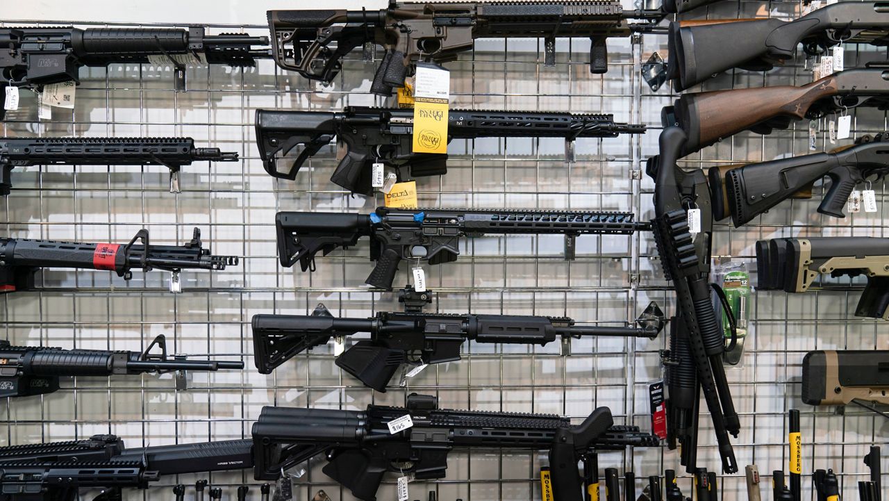 AR-15-style rifles are on display at Burbank Ammo & Guns in Burbank, Calif., June 23, 2022. 