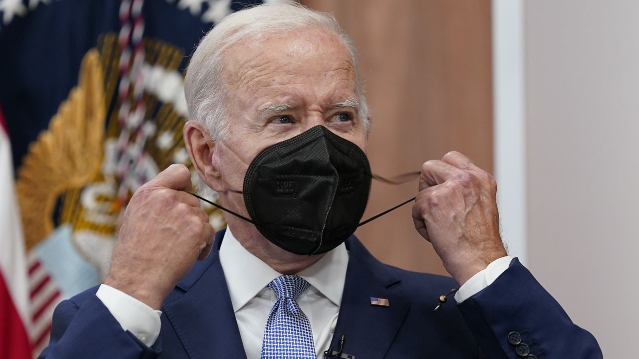 FILE - President Joe Biden removes his face mask as he arrives to speak about the economy during a meeting with CEOs in the South Court Auditorium on the White House complex in Washington, Thursday, July 28, 2022. Biden tested positive for COVID-19 again Saturday, July 30, slightly more than three days after he was cleared to exit coronavirus isolation, the White House said, in a rare case of “rebound” following treatment with an anti-viral drug. (AP Photo/Susan Walsh, File)