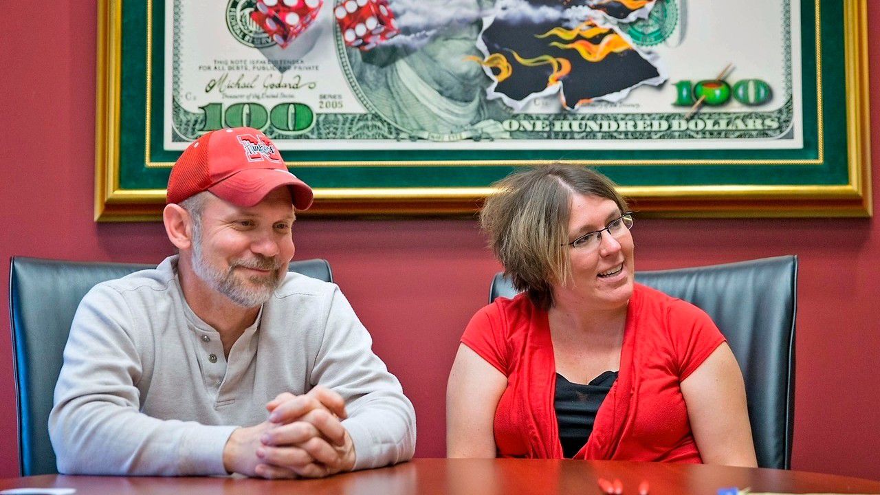 FILE - Powerball lottery winners David, left, and Erica Harrig, of Gretna, Neb., speak during an interview at the law office of their attorney Darren Carlson in Omaha, Neb., on Dec. 13, 2013. (Kent Sievers /Omaha World-Herald via AP, File)