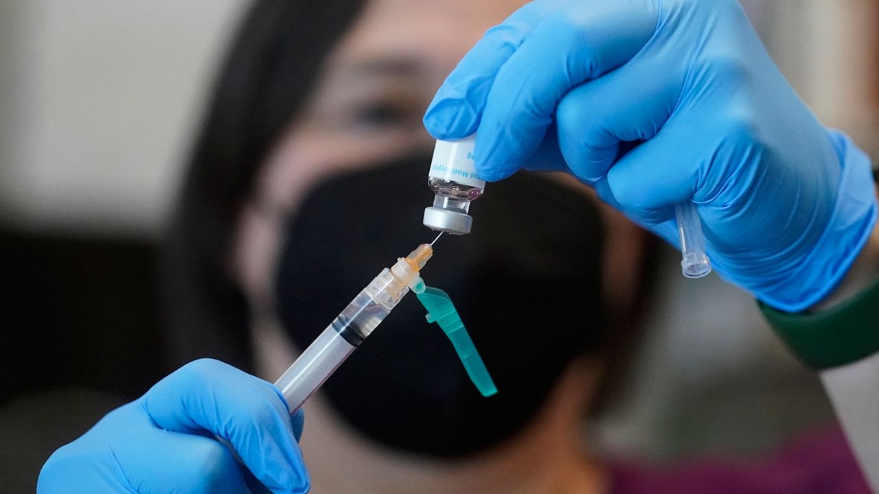 FILE - A registered nurse prepares a dose of a Monkeypox vaccine at the Salt Lake County Health Department Thursday, July 28, 2022, in Salt Lake City. (AP Photo/Rick Bowmer, File)