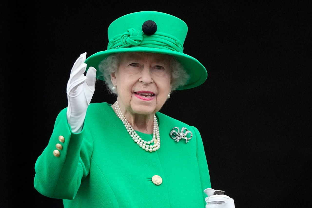 FILE - Queen Elizabeth II waves to the crowd during the Platinum Jubilee Pageant at the Buckingham Palace in London, Sunday, June 5, 2022, on the last of four days of celebrations to mark the Platinum Jubilee. Queen Elizabeth II, Britain’s longest-reigning monarch and a rock of stability across much of a turbulent century, has died. She was 96. Buckingham Palace made the announcement in a statement on Thursday Sept. 8, 2022. (AP Photo/Frank Augstein, File)