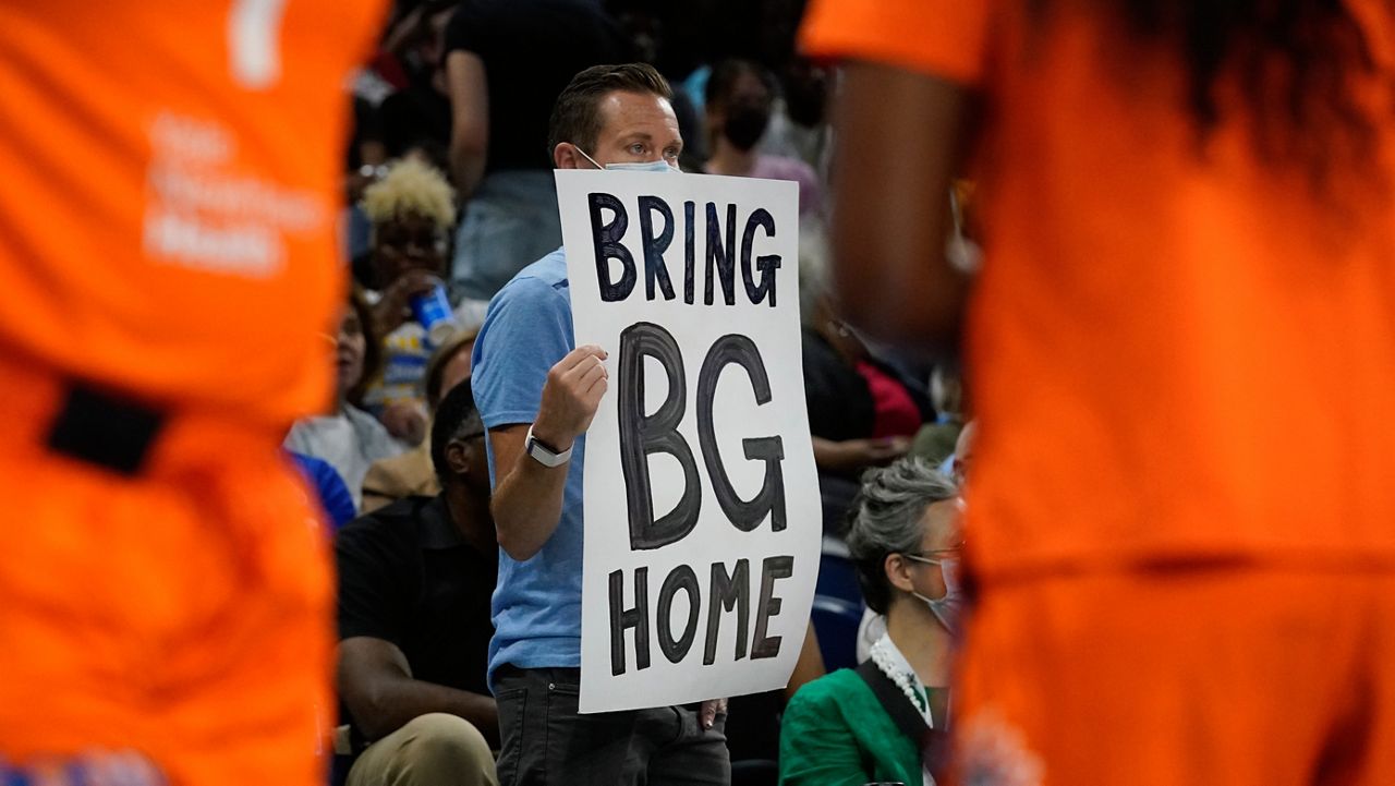 A person holds up a sign reminding fans of Phoenix Mercury's Brittney Griner during the first half of Game 2 in a WNBA basketball playoffs semifinal between the Chicago Sky and the Connecticut Sun on Wednesday, Aug. 31, 2022, in Chicago. (AP Photo/Nam Y. Huh)