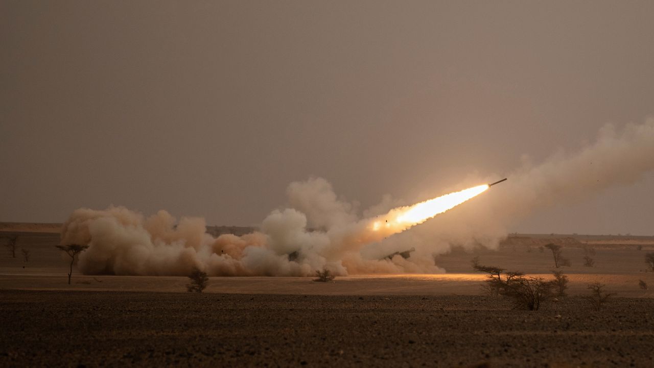 FILE - A launch truck fires the High Mobility Artillery Rocket System (HIMARS) at its intended target during the African Lion military exercise in Grier Labouihi complex, southern Morocco, on June 9, 2021. (AP Photo/Mosa'ab Elshamy, File)