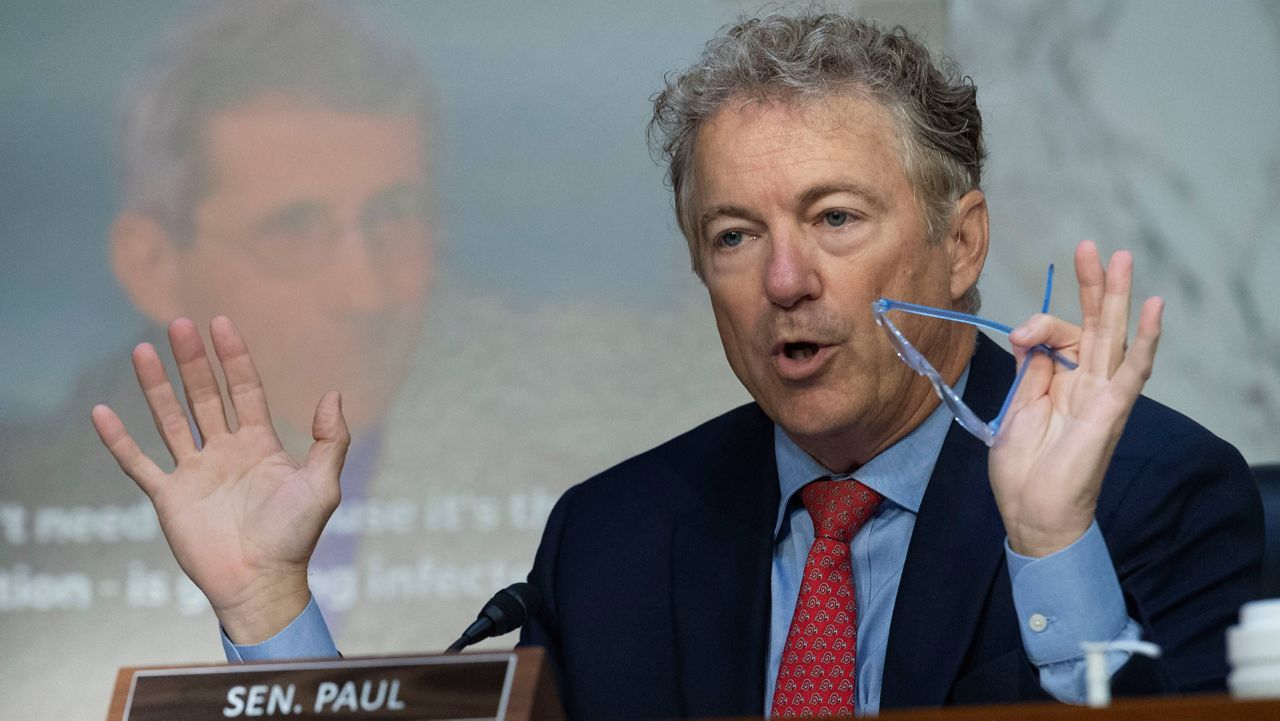 Sen. Rand Paul, R-Ky, questions Anthony Fauci, Director, National Institute of Allergy and Infectious Diseases, National Institutes of Health, while displaying a video and poster of Fauci, during the Senate Health, Education, Labor, and Pensions hearing to examine stopping the spread of monkeypox, focusing on the Federal response, in Washington, Wednesday, Sept. 14, 2022. (AP Photo/Cliff Owen)