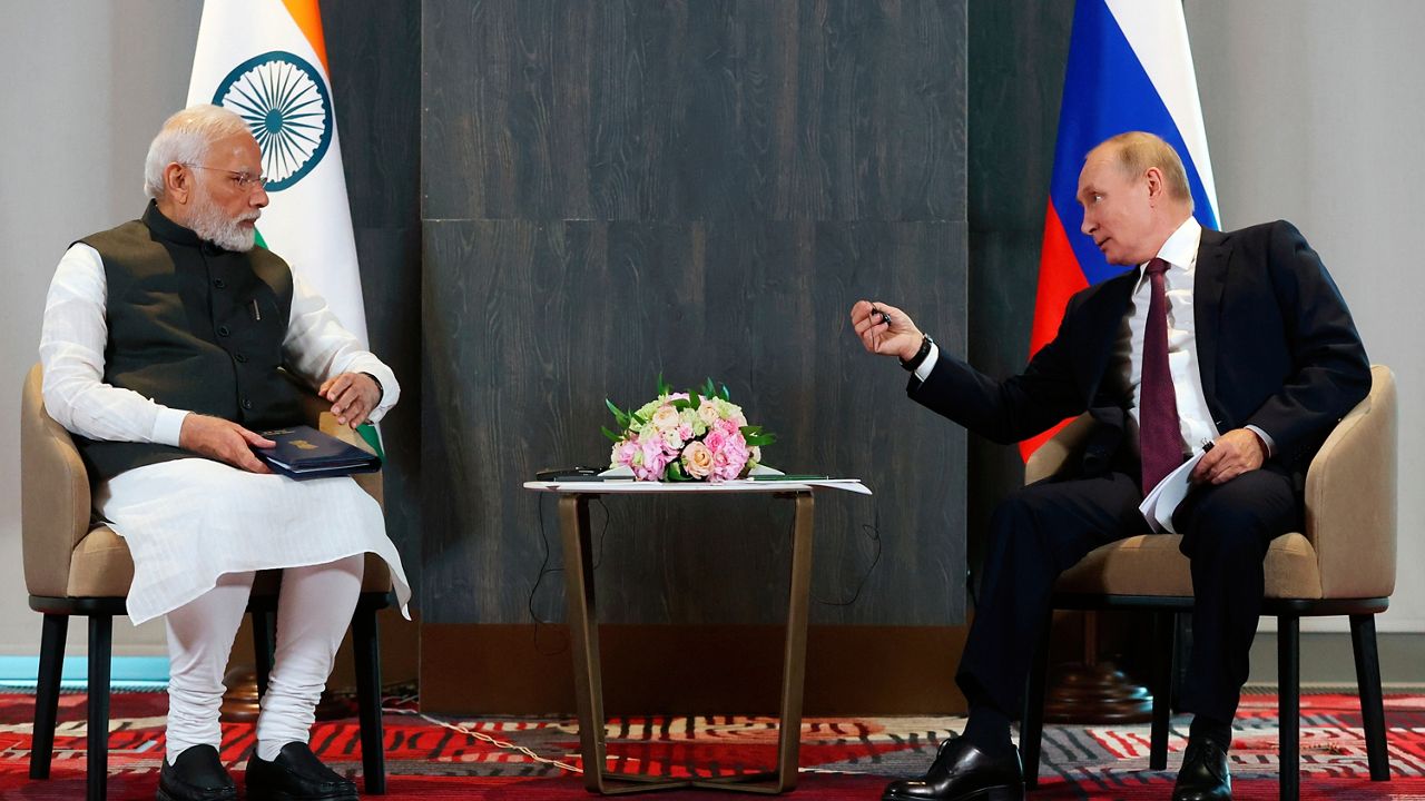 Russian President Vladimir Putin, right, speaks to Indian Prime Minister Narendra Modi during their talks on the sidelines of the Shanghai Cooperation Organisation (SCO) summit in Samarkand, Uzbekistan, Friday, Sept. 16, 2022. (Alexandr Demyanchuk, Sputnik, Kremlin Pool Photo via AP)