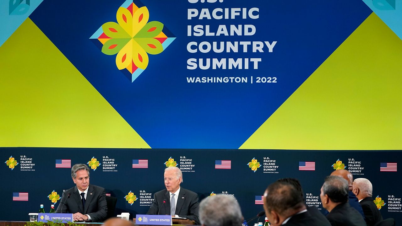 President Joe Biden speaks during the first U.S.-Pacific Island Country Summit at the State Department in Washington, Thursday, Sept. 29, 2022. Secretary of State Antony Blinken listens at left. (AP Photo/Susan Walsh)